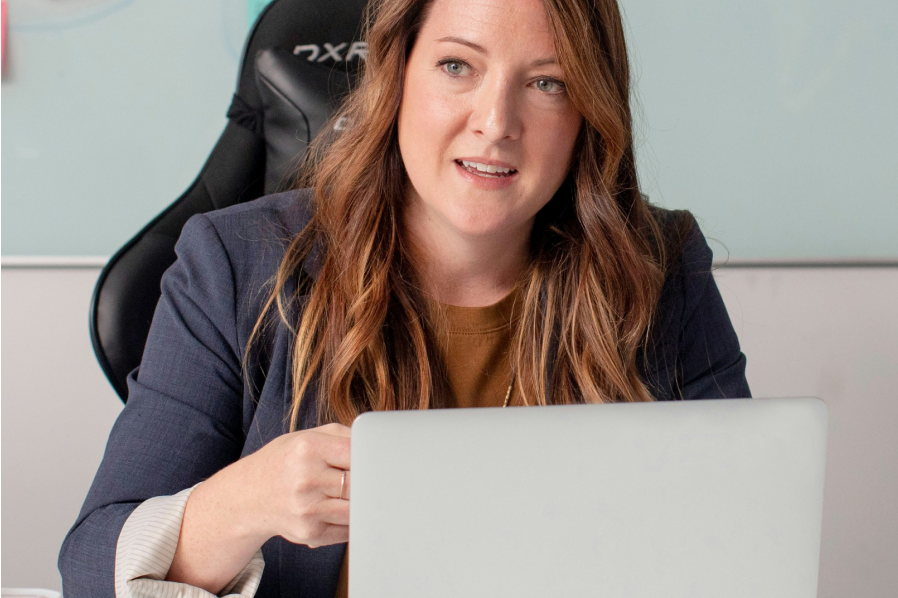 A woman in a meeting, surrounded by post-it notes and productive ideas.